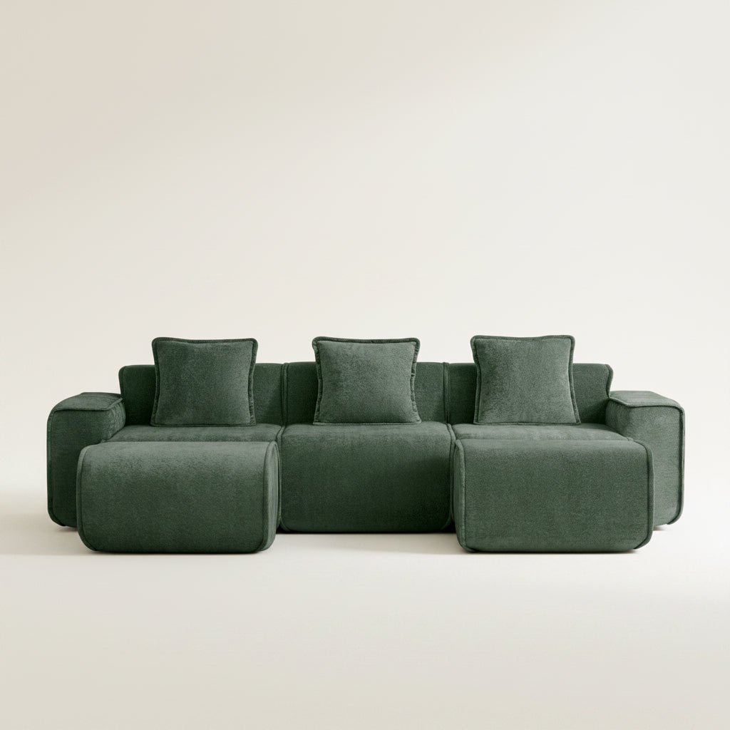 Green sectional sofa on a white background