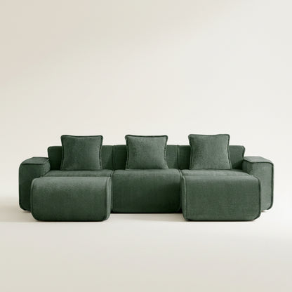 Green sectional sofa on a white background