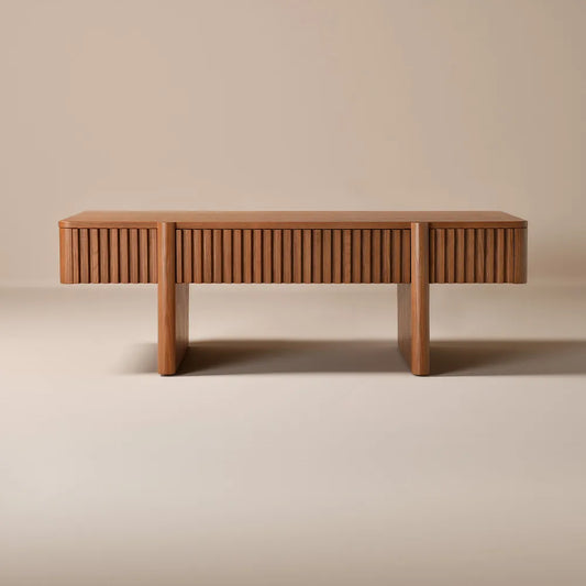 front view of a solid ash wood coffee table with fluted sides and hidden storage in mid century modern style