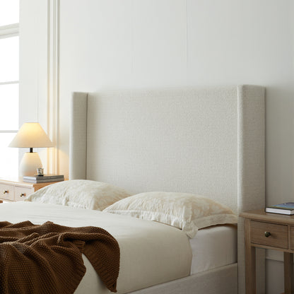 Full studio shot of cream king bed frame on white background