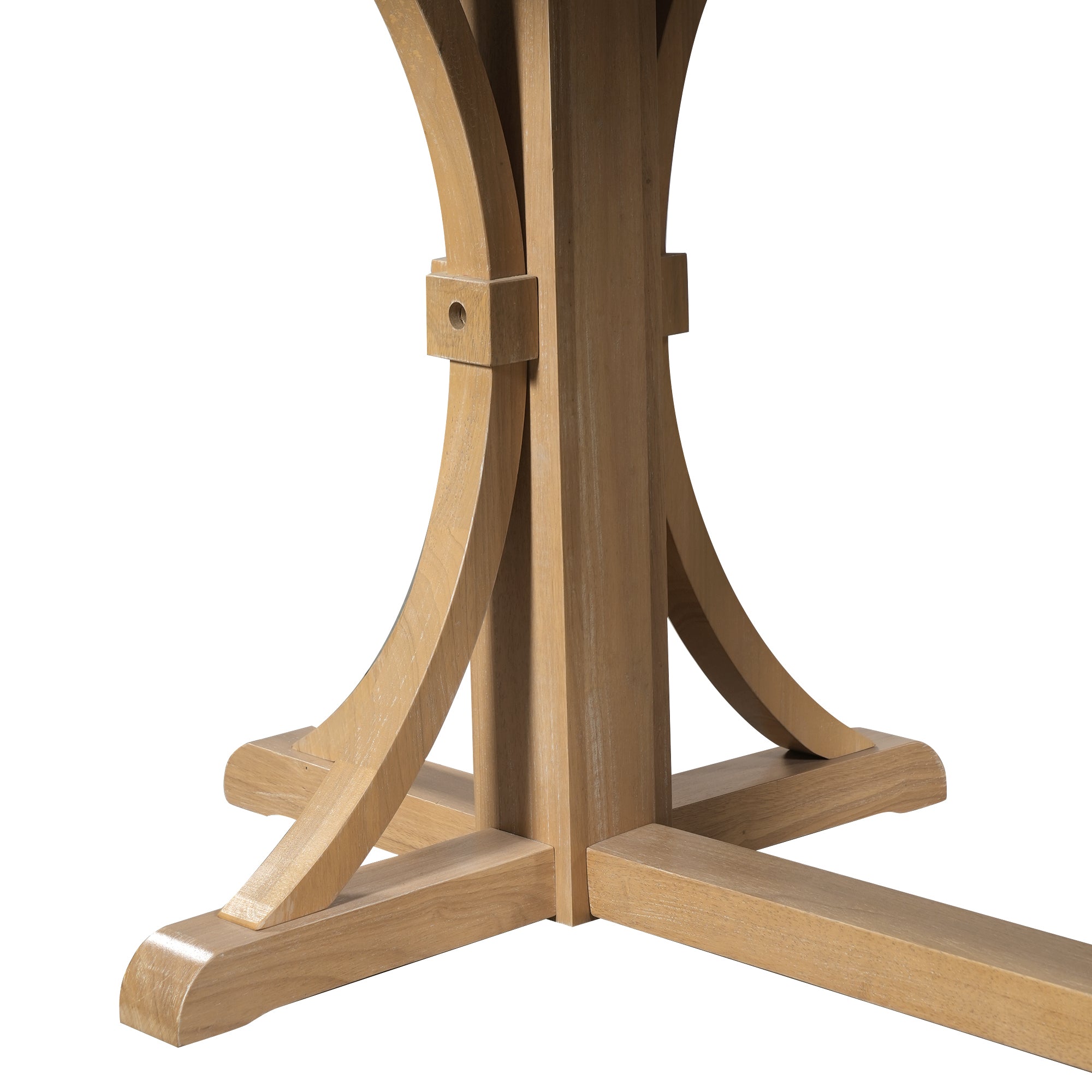 Close-up of the trestle base foot meeting the center stretcher on the wood dining table