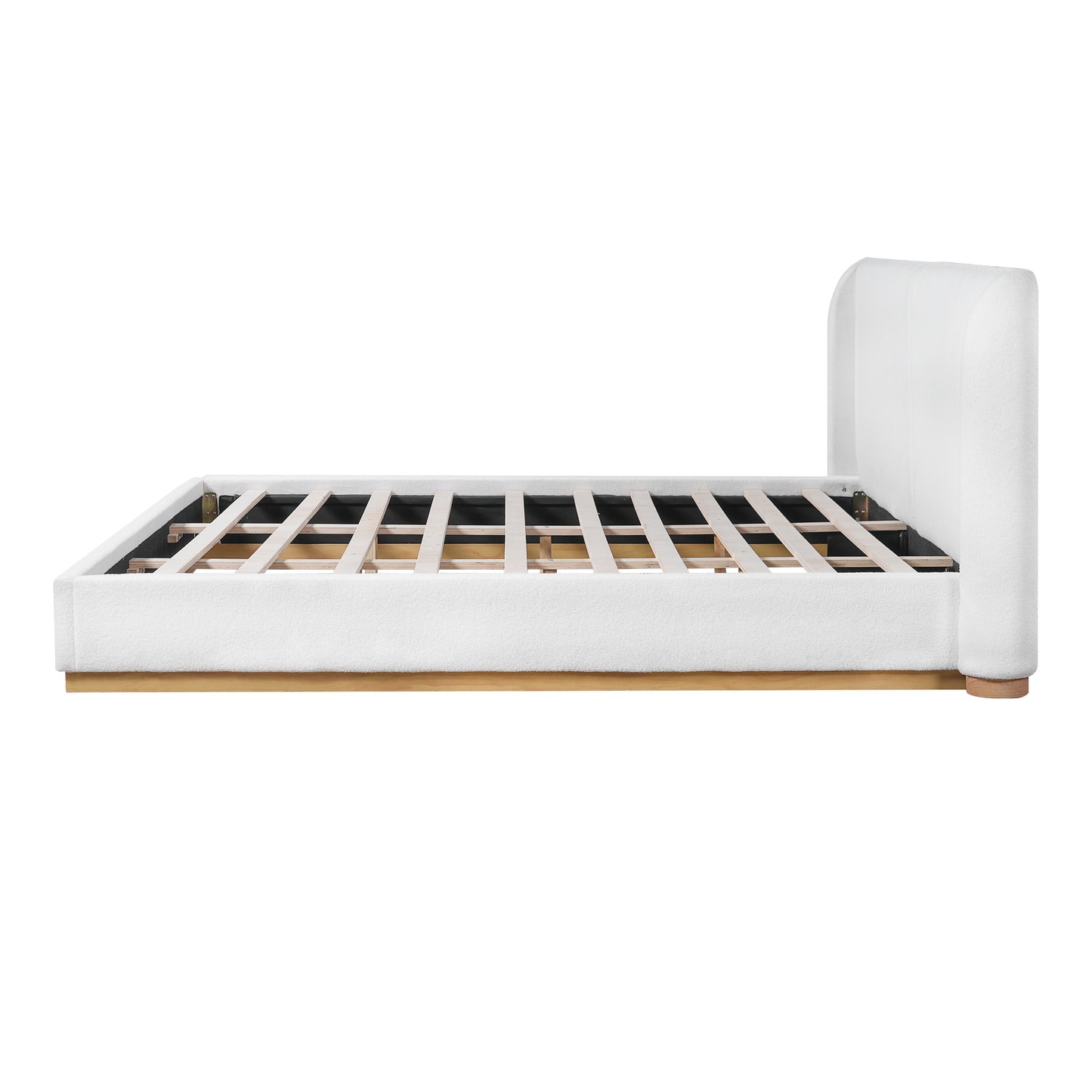Close-up of wood base corner joint on white bouclé king bed frame