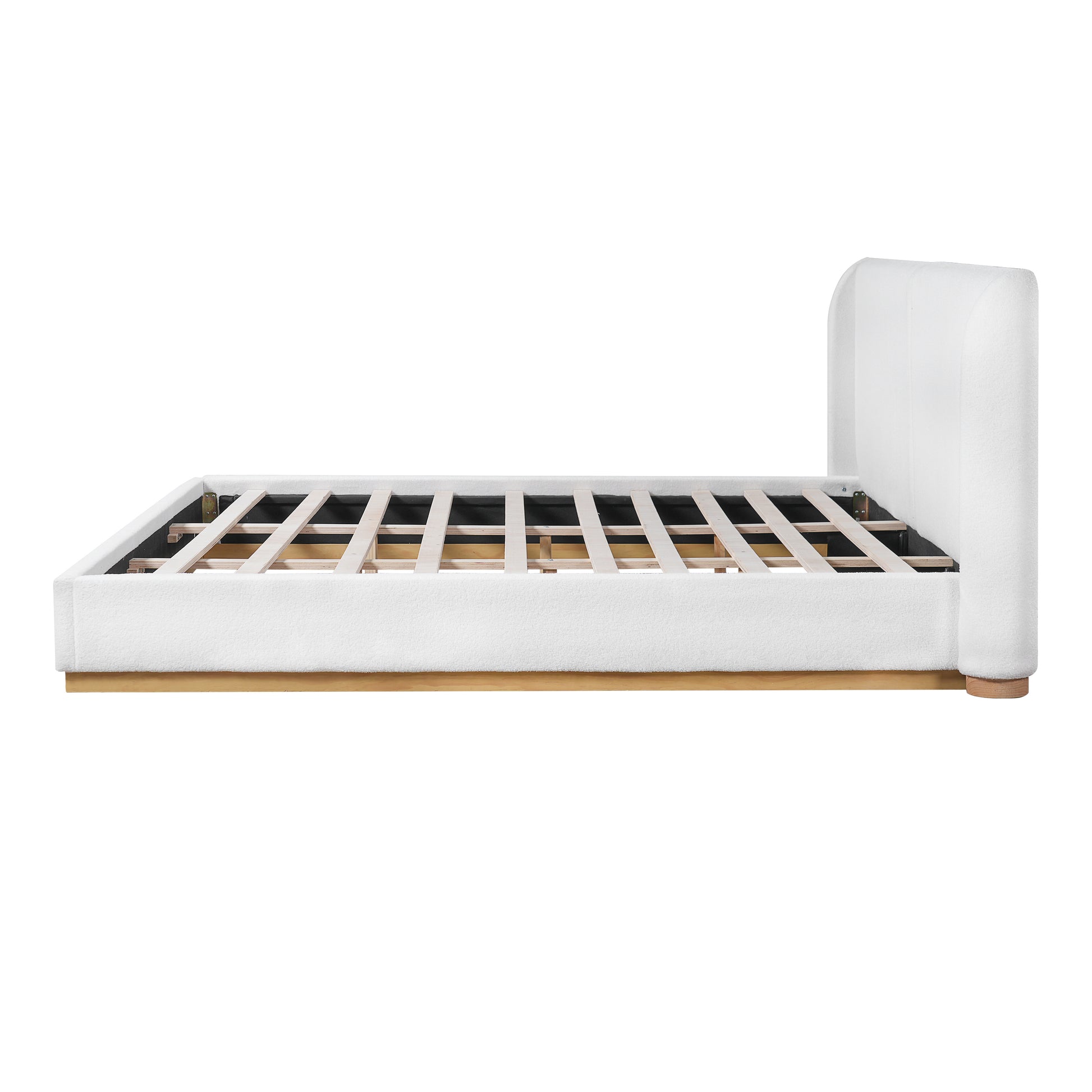 Close-up of wood base corner joint on white bouclé king bed frame