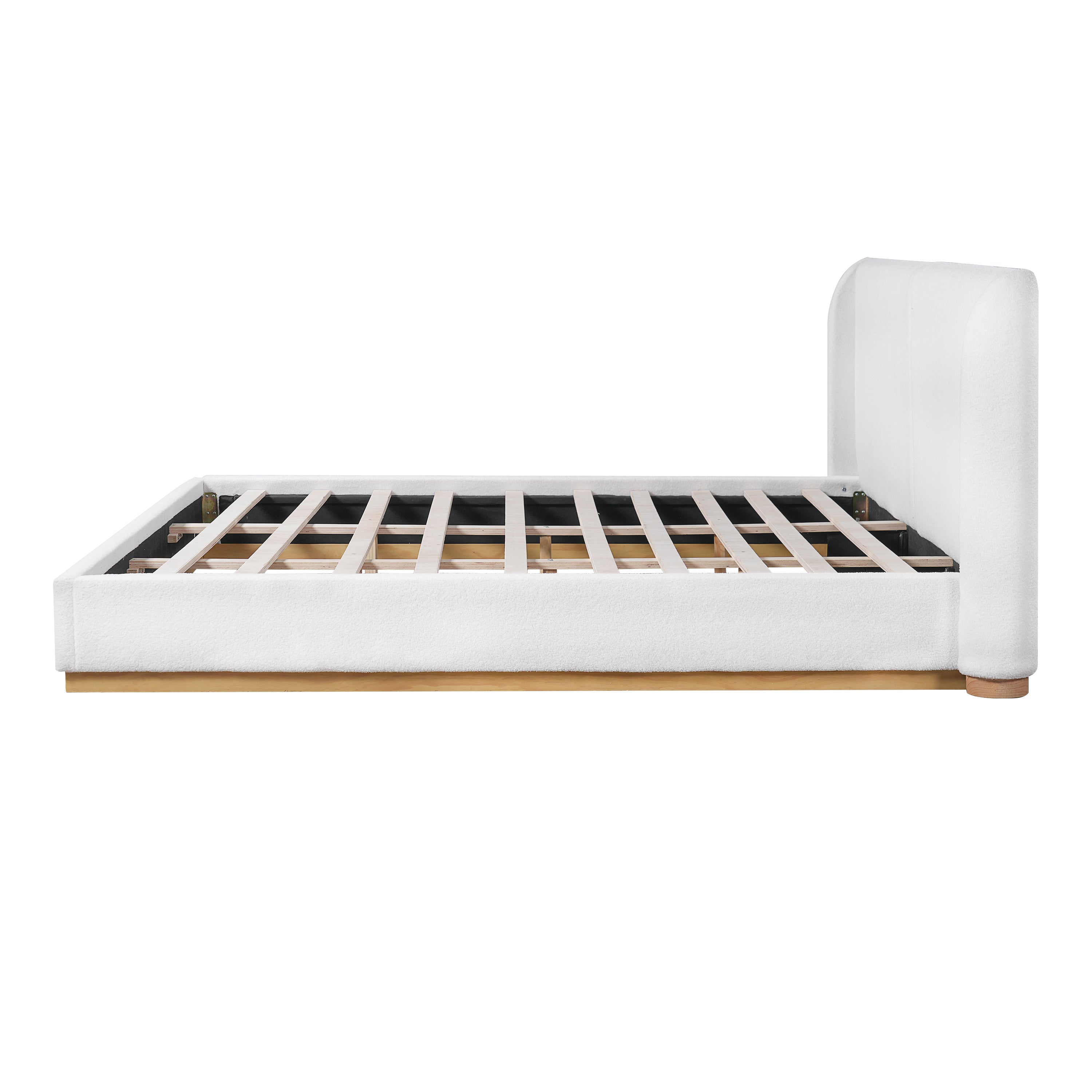 Close-up of wood base corner joint on white bouclé king bed frame