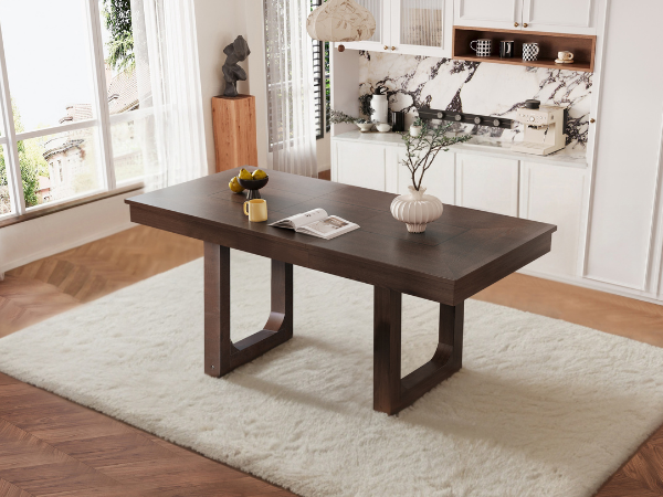 Three-quarter room view of the walnut extendable dining table styled with decor