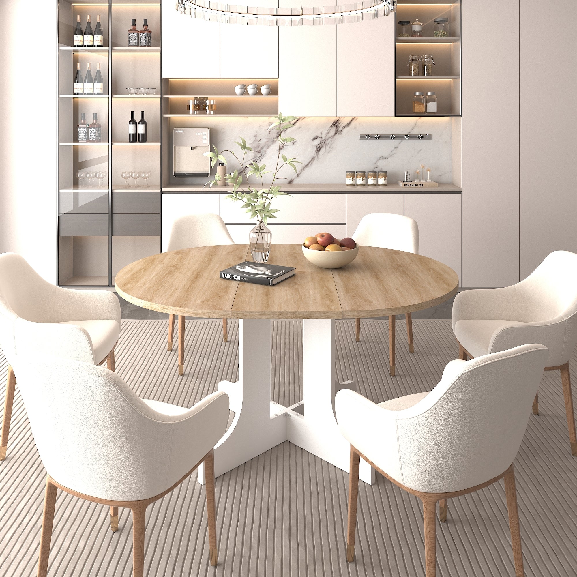 Oak-top oval dining table with a white pedestal base and cream armchairs in a modern kitchen