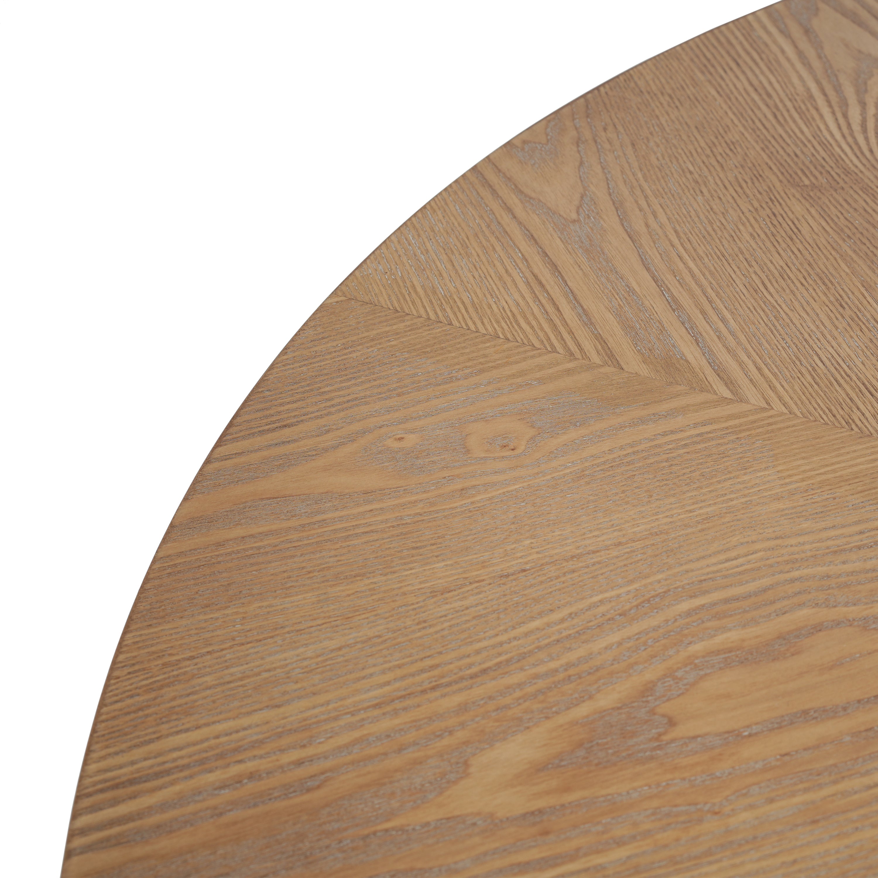 Close-up of the round oak tabletop showing the radial grain seams