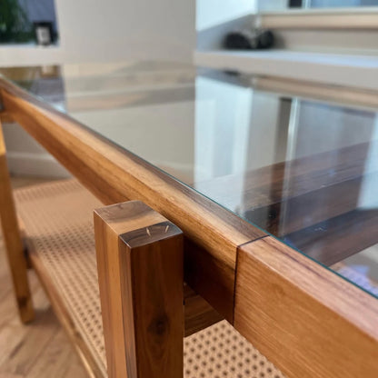 detail shot of the coloration of natural acacia wood on a coffee table with tempered glass