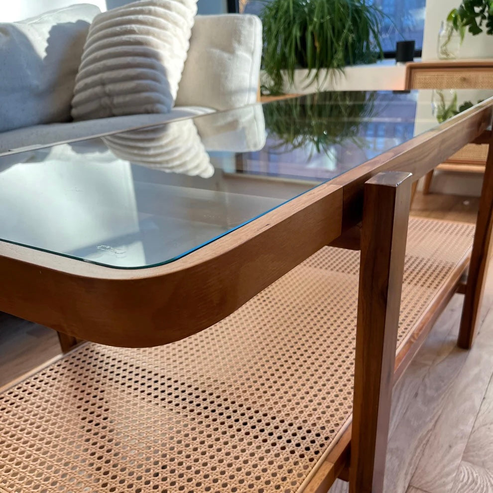 close up of acacia wood in coffee table with tempered glass giving reflection into the room