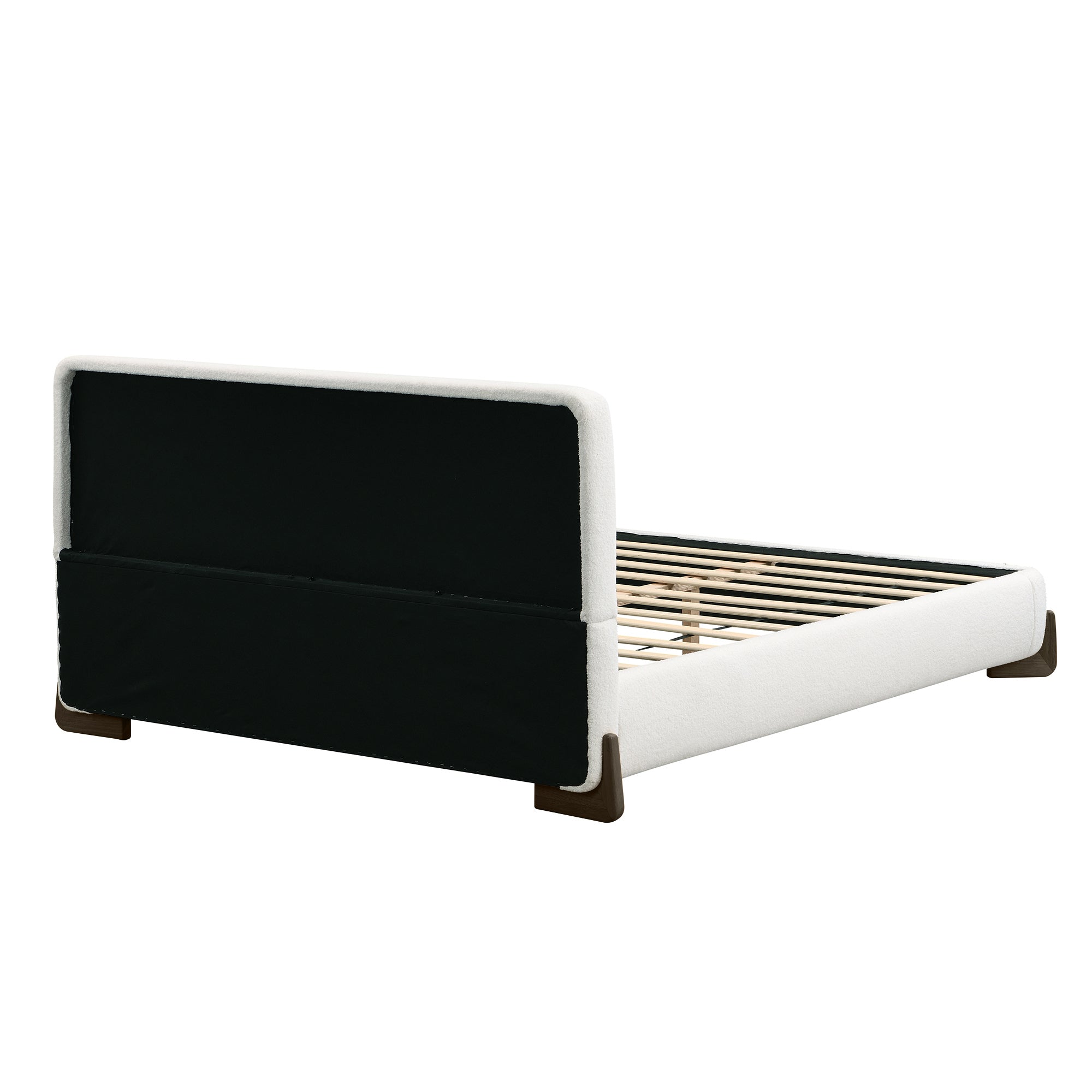 Rear angled view of white bouclé king bed frame showing wood legs