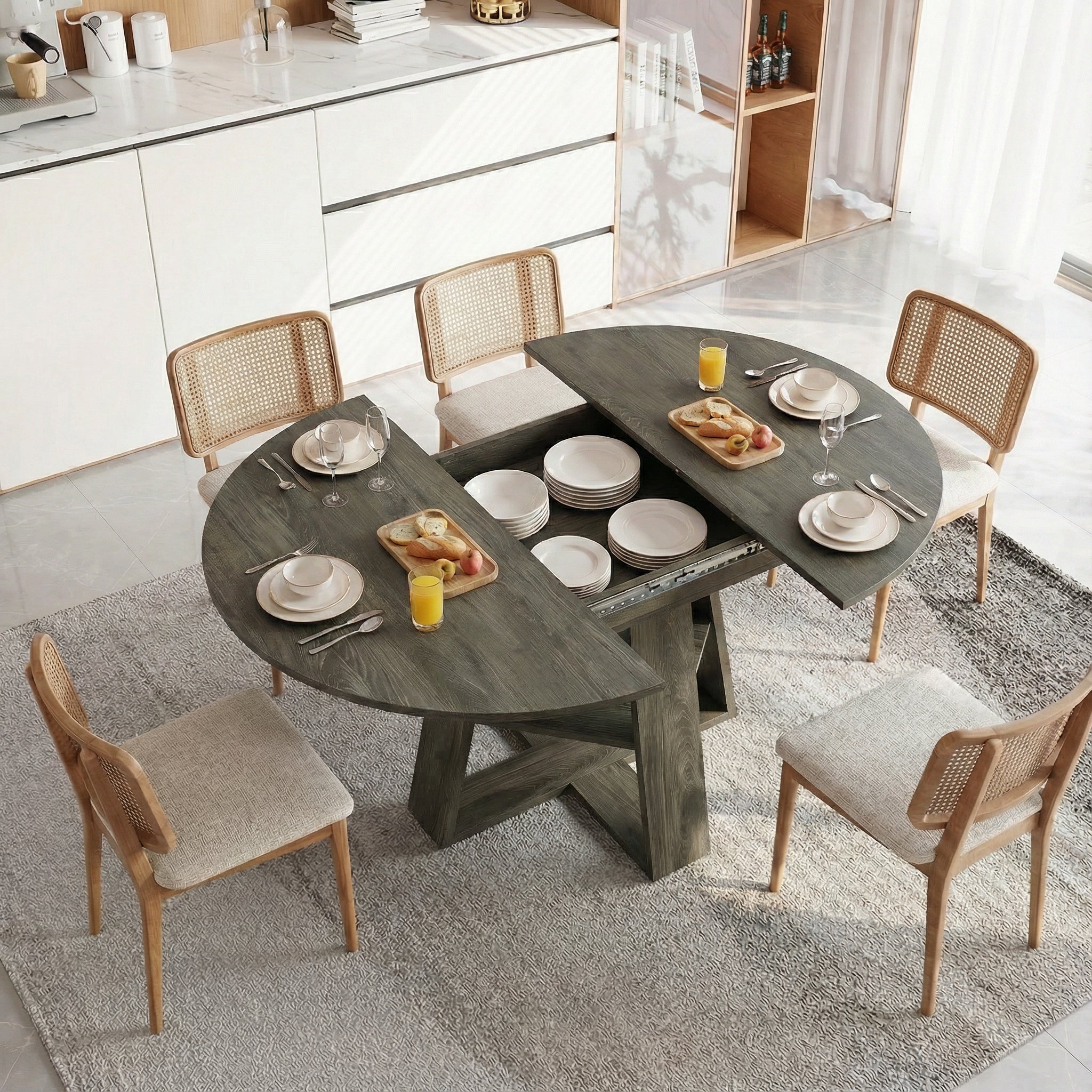 Overhead view of the gray table opened to reveal hidden storage with stacked dishes