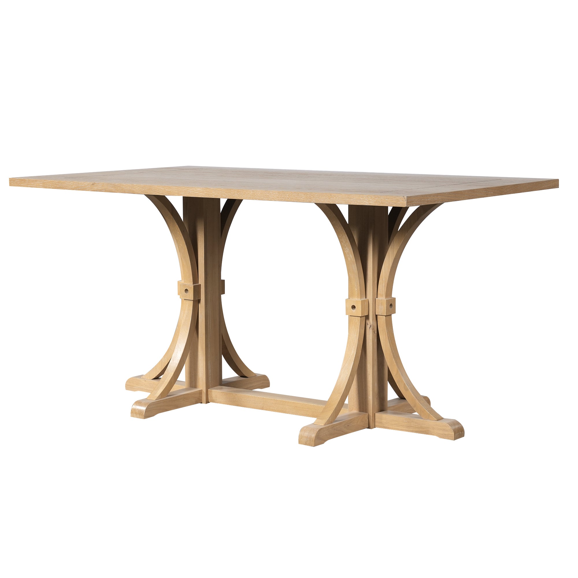 Angled studio view of the farmhouse trestle dining table showing curved pedestal legs, white background