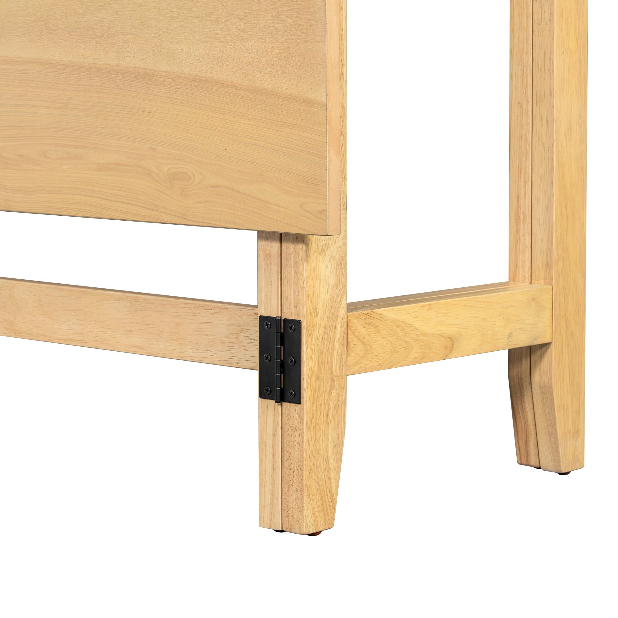Close-up of the black metal hinge and folding leg on the natural wood drop-leaf table