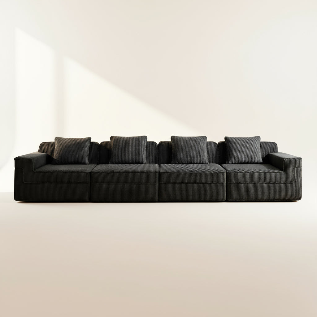 studio photography of the boneless couch showing deep seats and the plush black corduroy upholstery