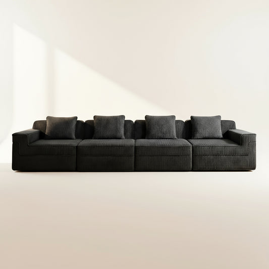 studio photography of the boneless couch showing deep seats and the plush black corduroy upholstery