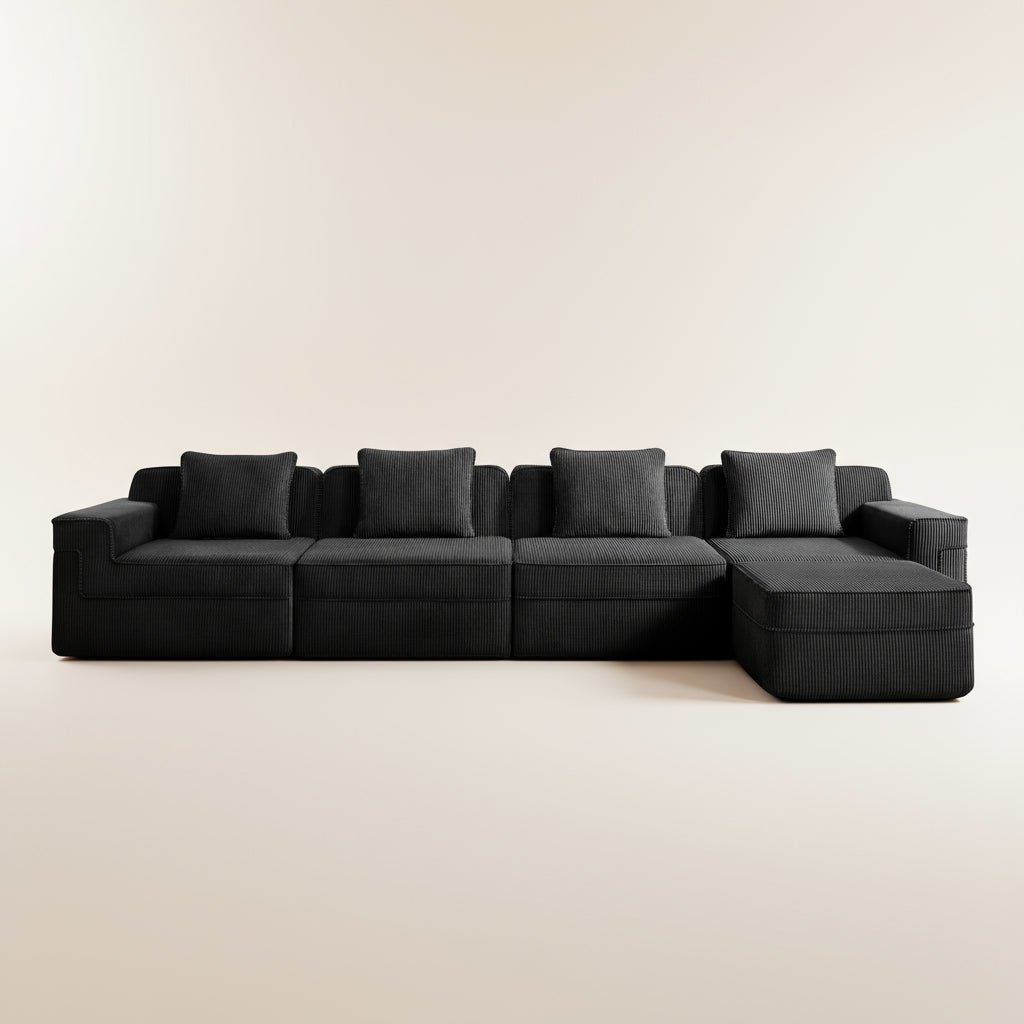 studio image of the black boneless couch in corduroy showing the deep seats comfortable nature and plush pillows