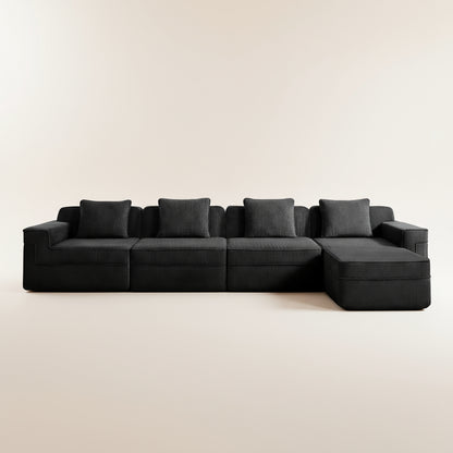 studio image of the black boneless couch in corduroy showing the deep seats comfortable nature and plush pillows