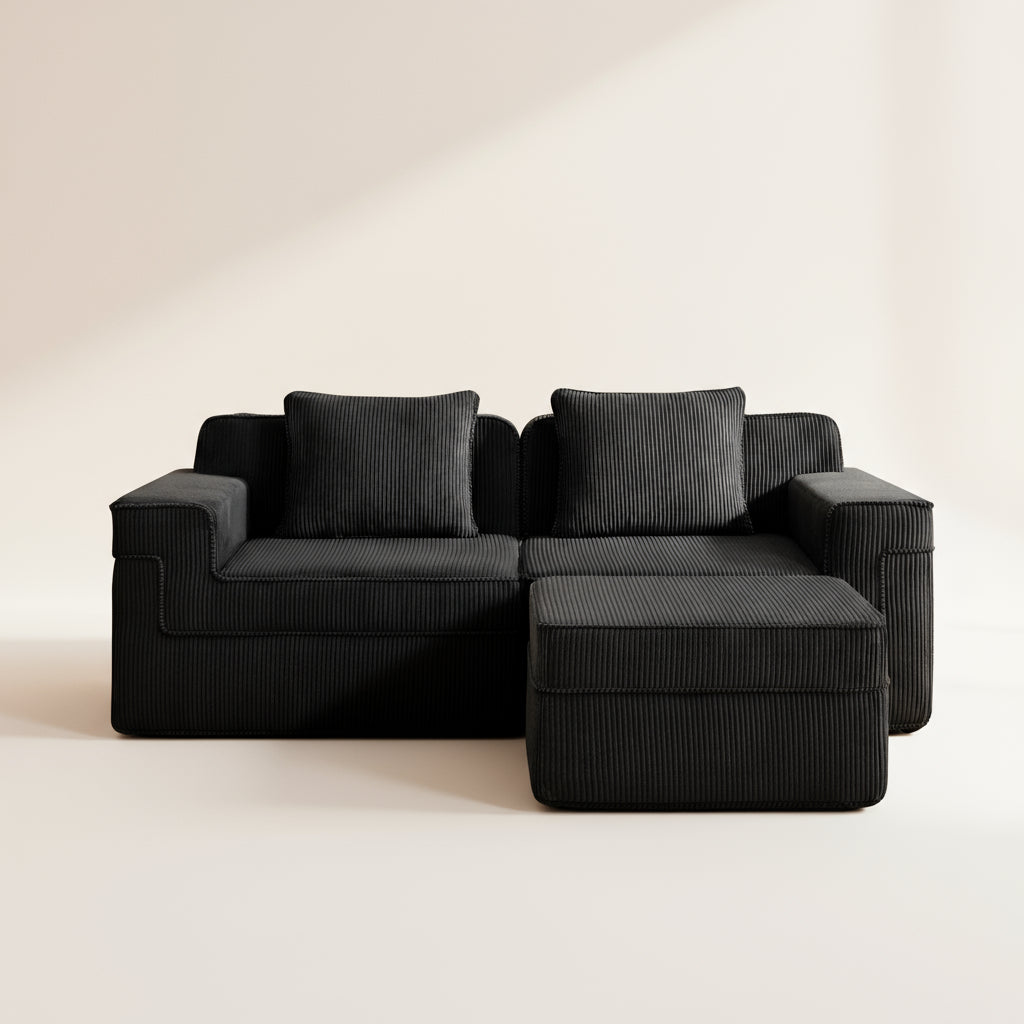 studio shot of the boneless couch in black corduroy showing the texture of the upholstery and deep comfortable seats