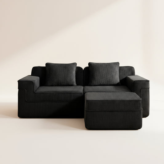 studio shot of the boneless couch in black corduroy showing the texture of the upholstery and deep comfortable seats