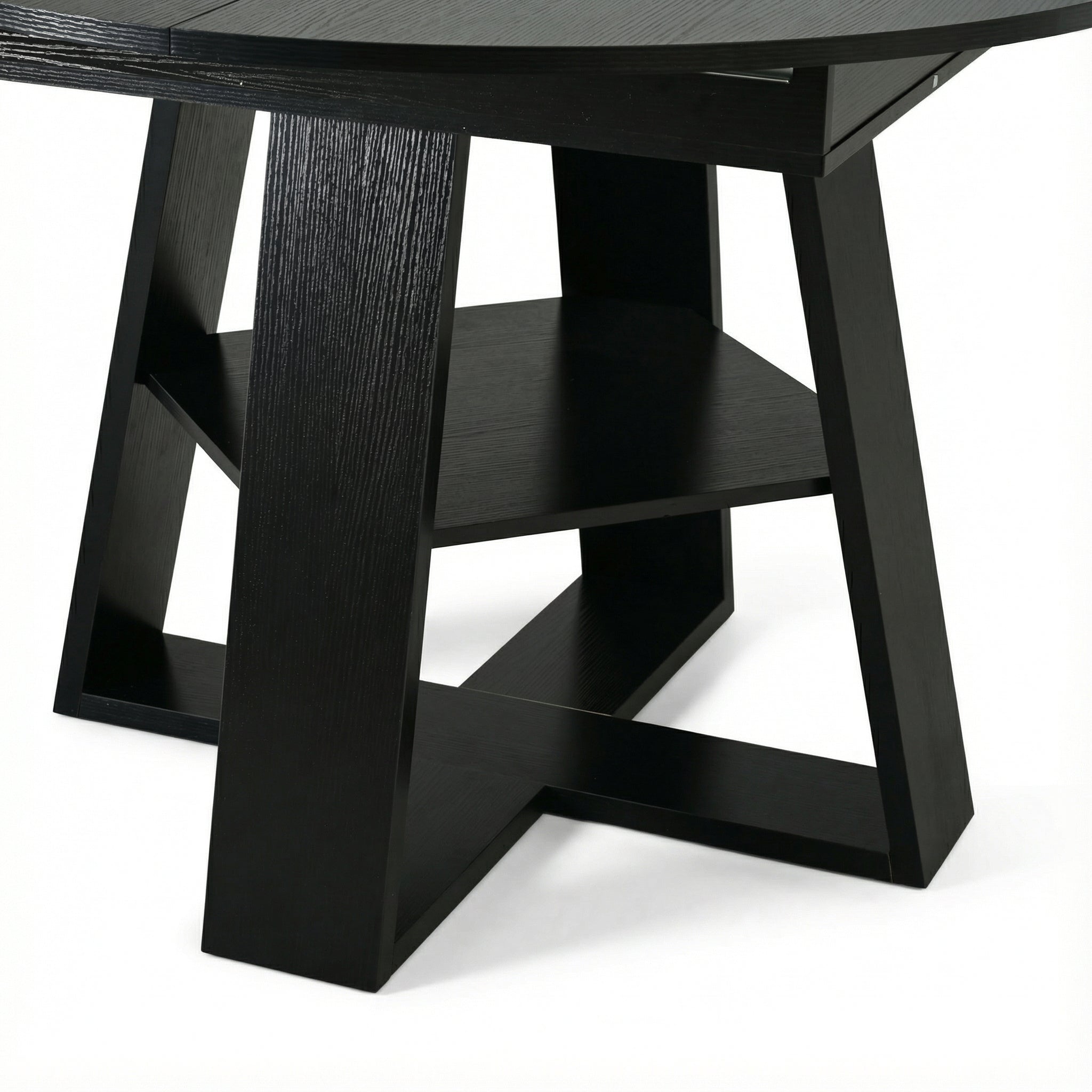 Close-up of the black cross-shaped base and lower storage shelf