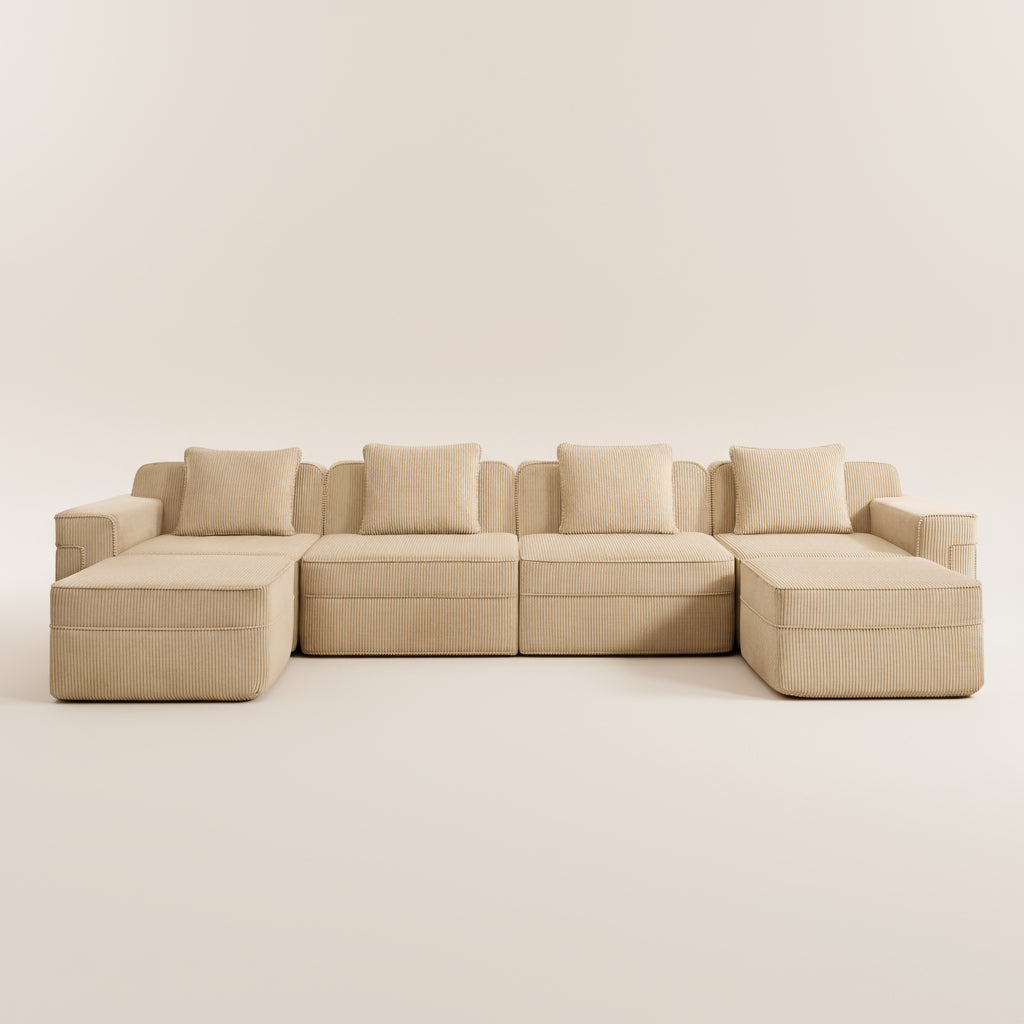 studio photograph of the boneless couch in camel corduroy showing the modular sectional as well as deep seats comfortable fabric and plush pillows