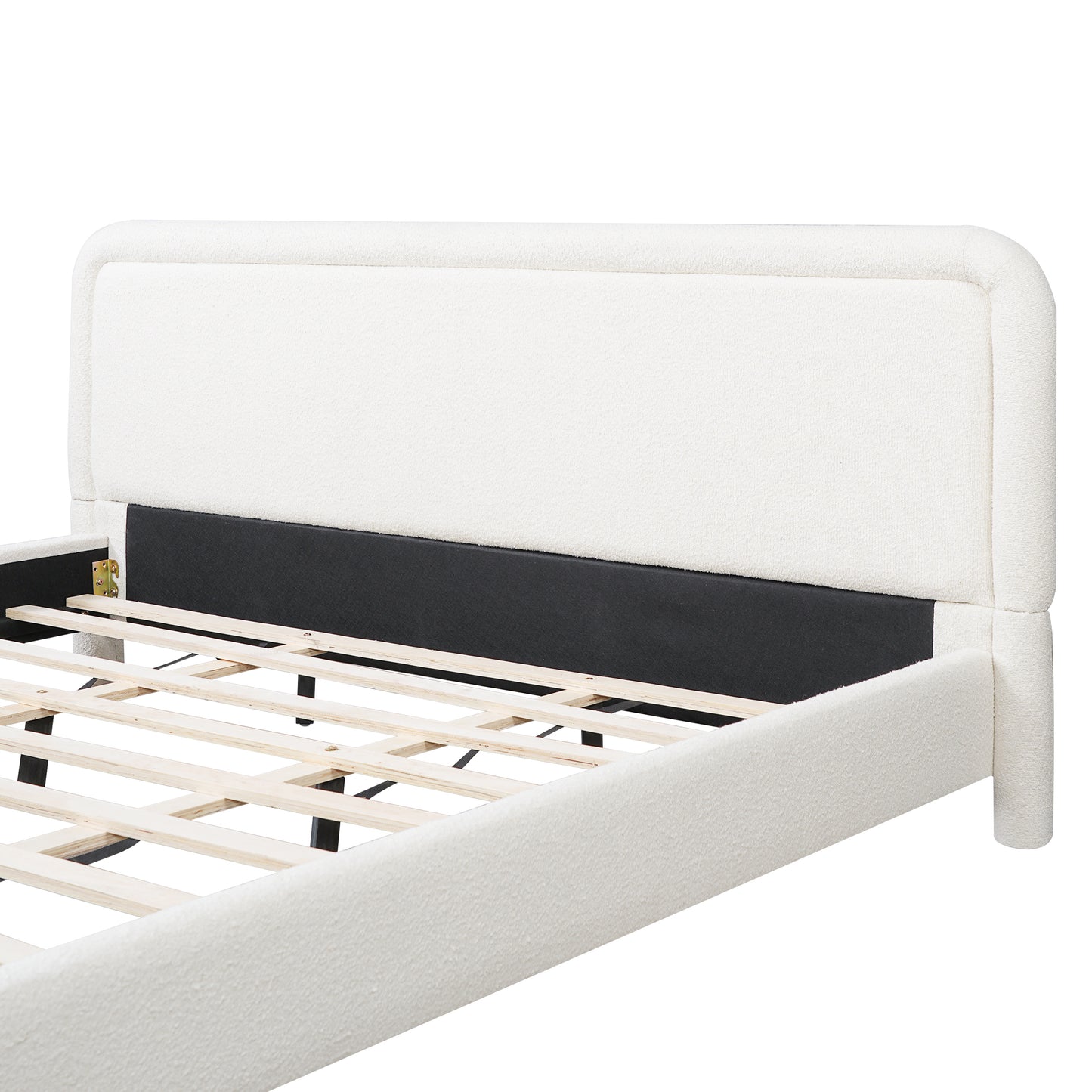 Close-up of curved headboard corner on white boucle king bed frame