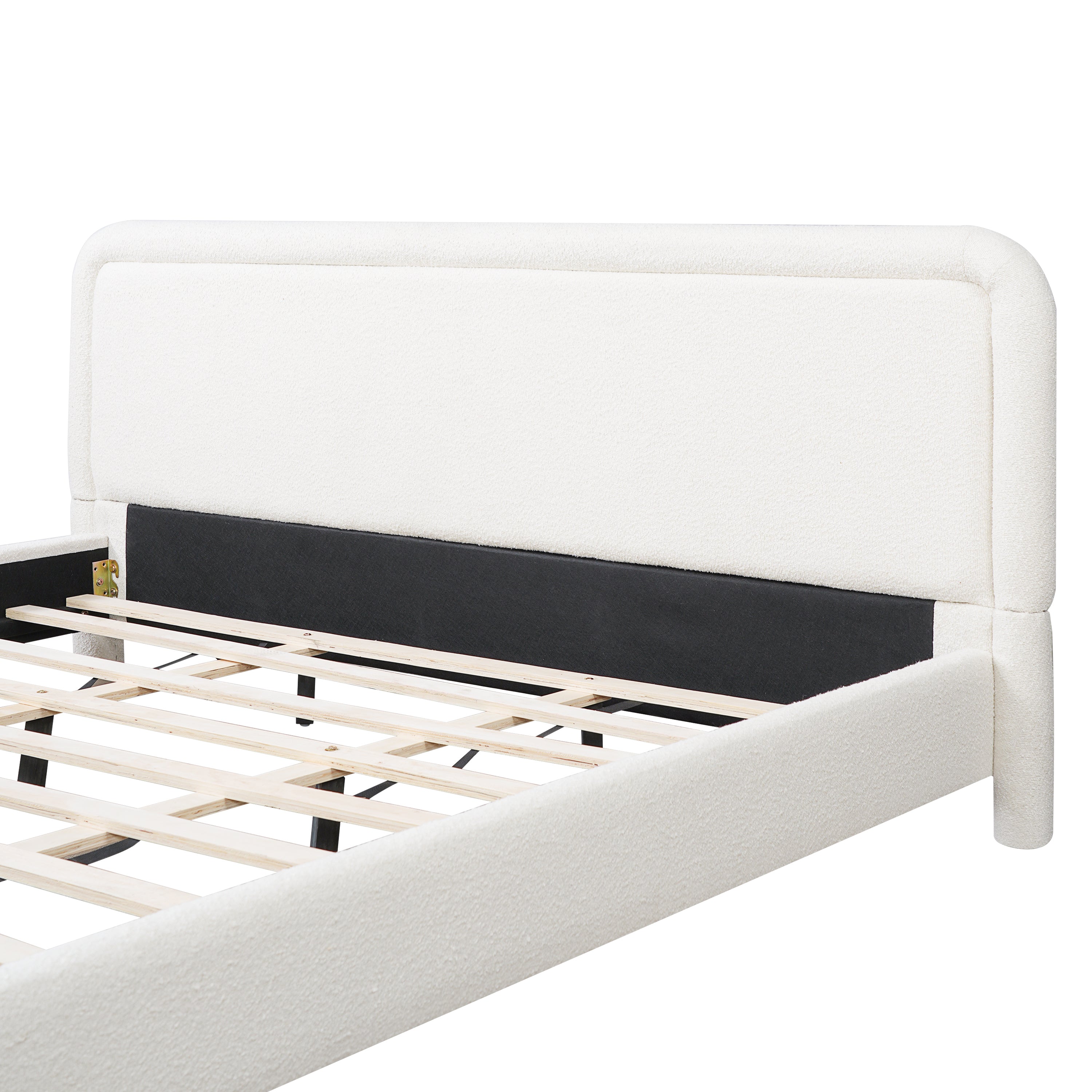 Close-up of curved headboard corner on white boucle king bed frame