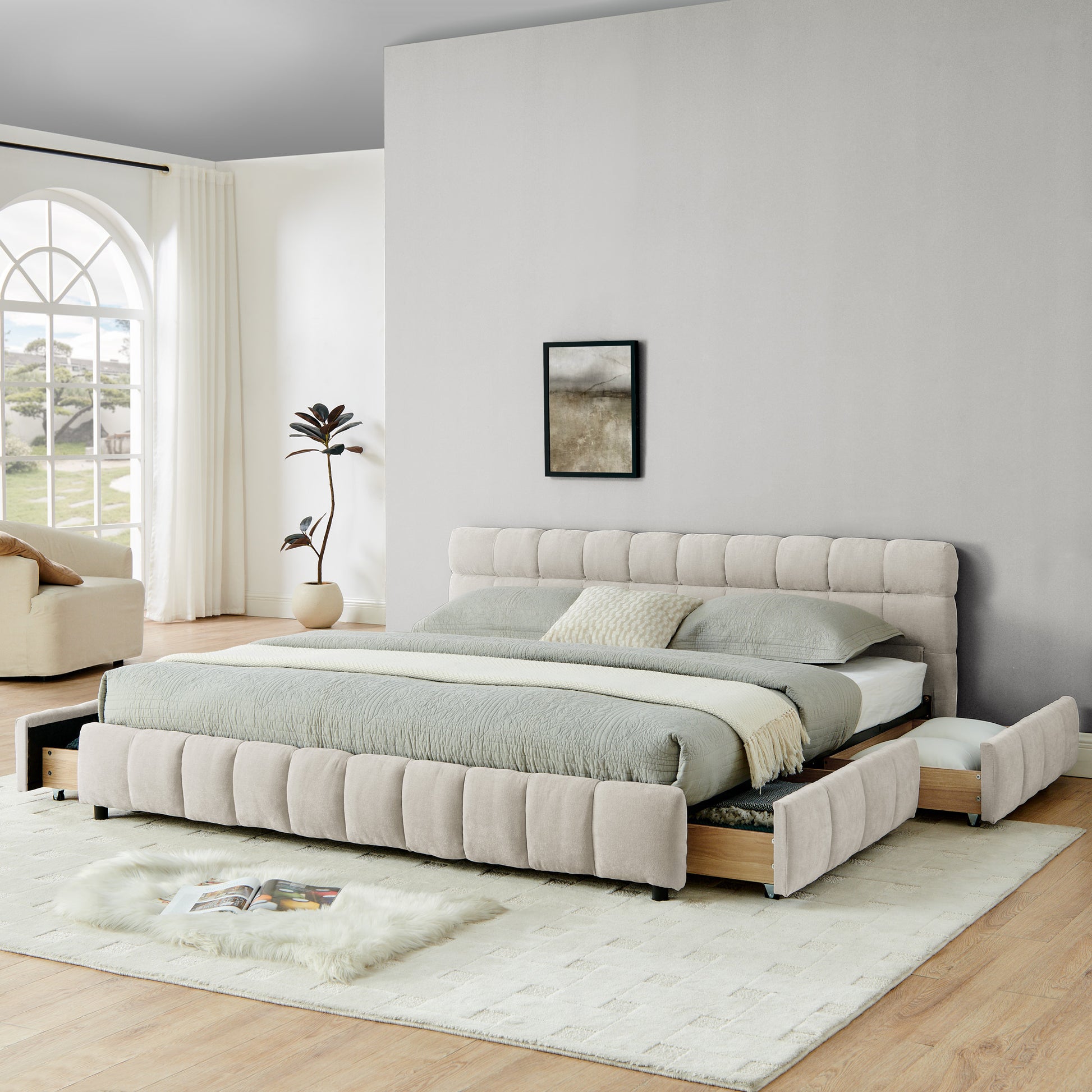 Wide bedroom shot of beige chenille king storage bed near window