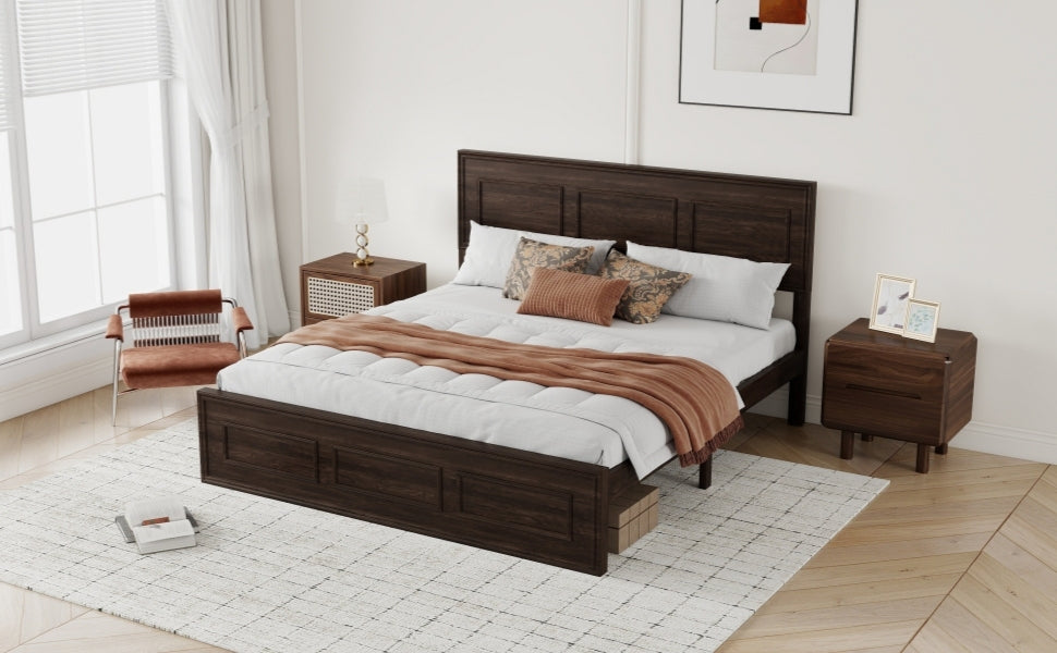 Cropped angled view of rich brown queen bed footboard with rust bedding and nightstand