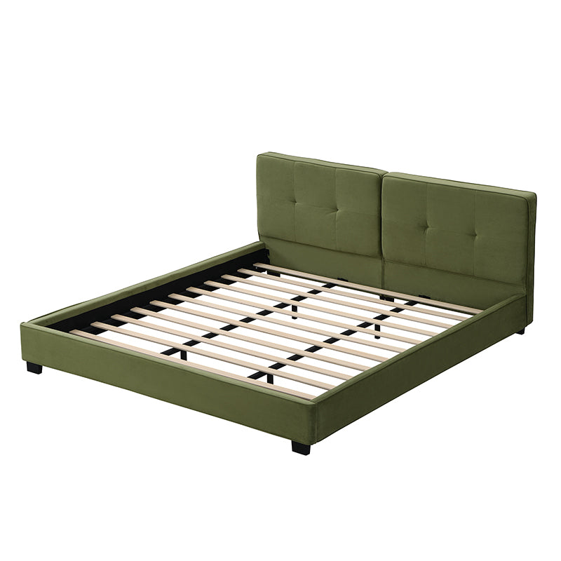Close-up of square-tufted headboard button detail on olive velvet