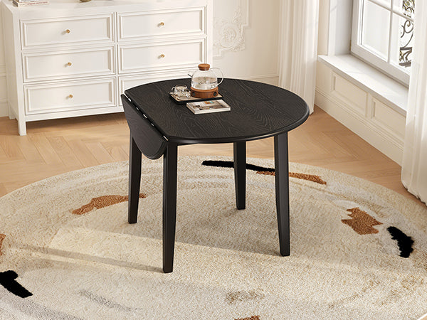 Styled room with the full round black table and a floor lamp