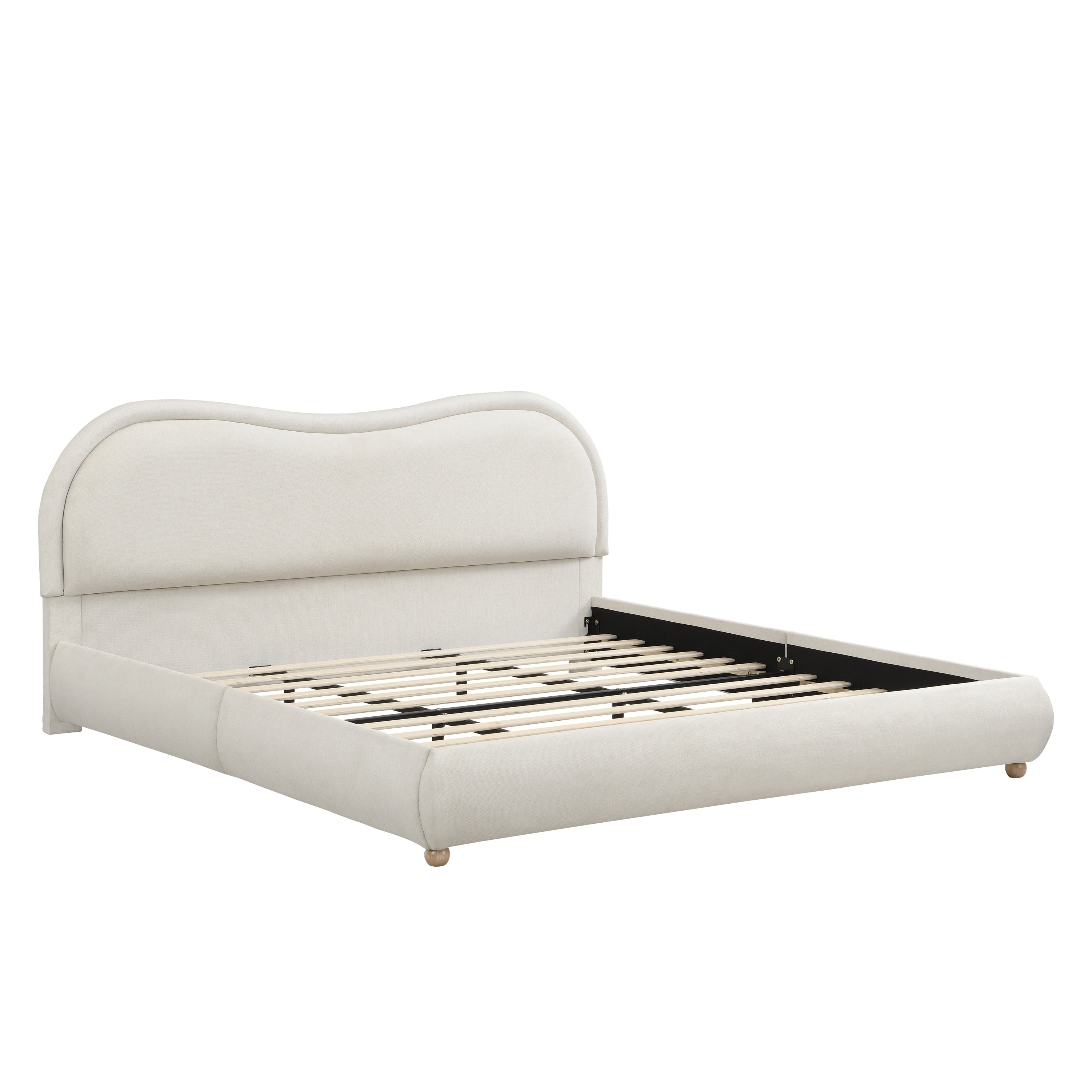Close-up of round wood leg and upholstered corner on beige bed frame