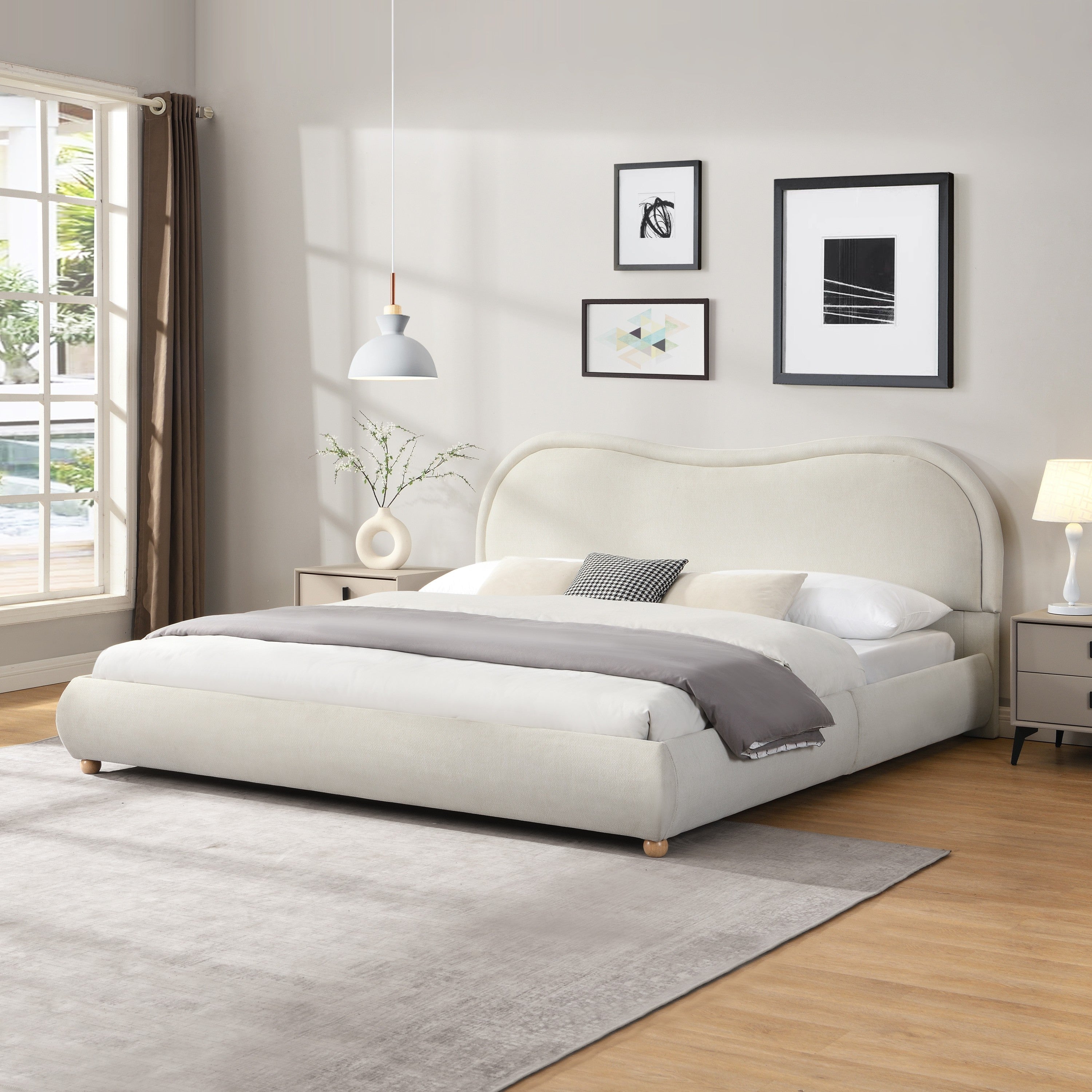 Beige chenille king bed in a bedroom with matching nightstands and pendant light