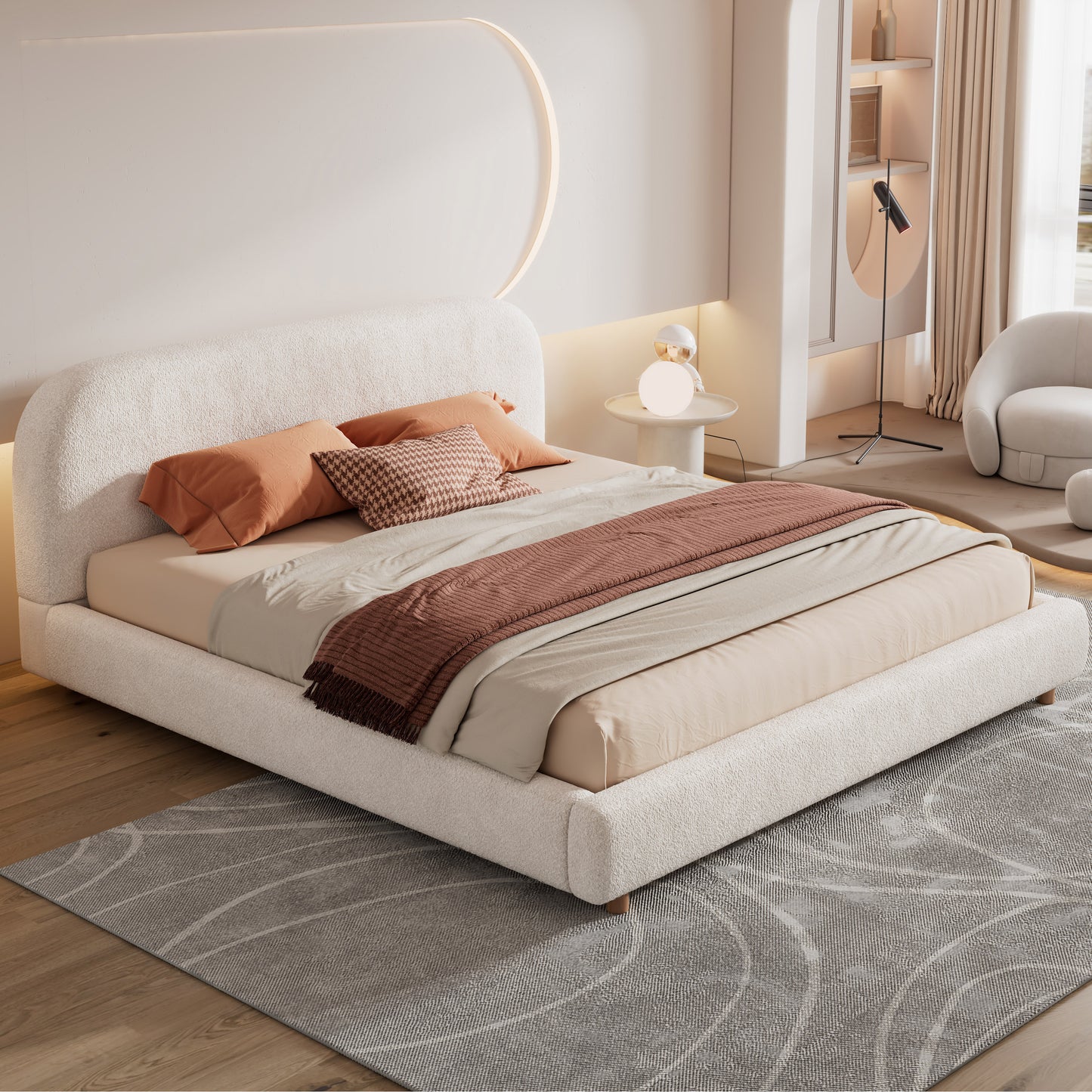 White boucle king platform bed with curved headboard in a warm modern bedroom
