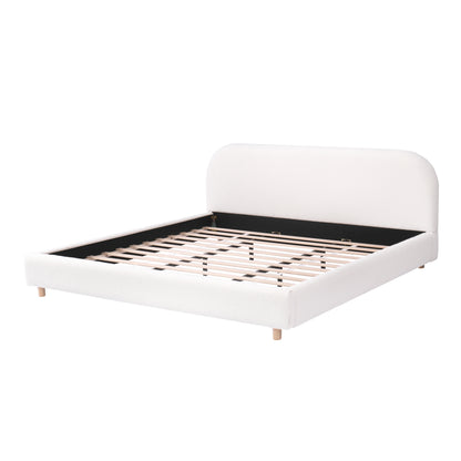 White boucle king bed frame, three-quarter angle showing wood slats and legs
