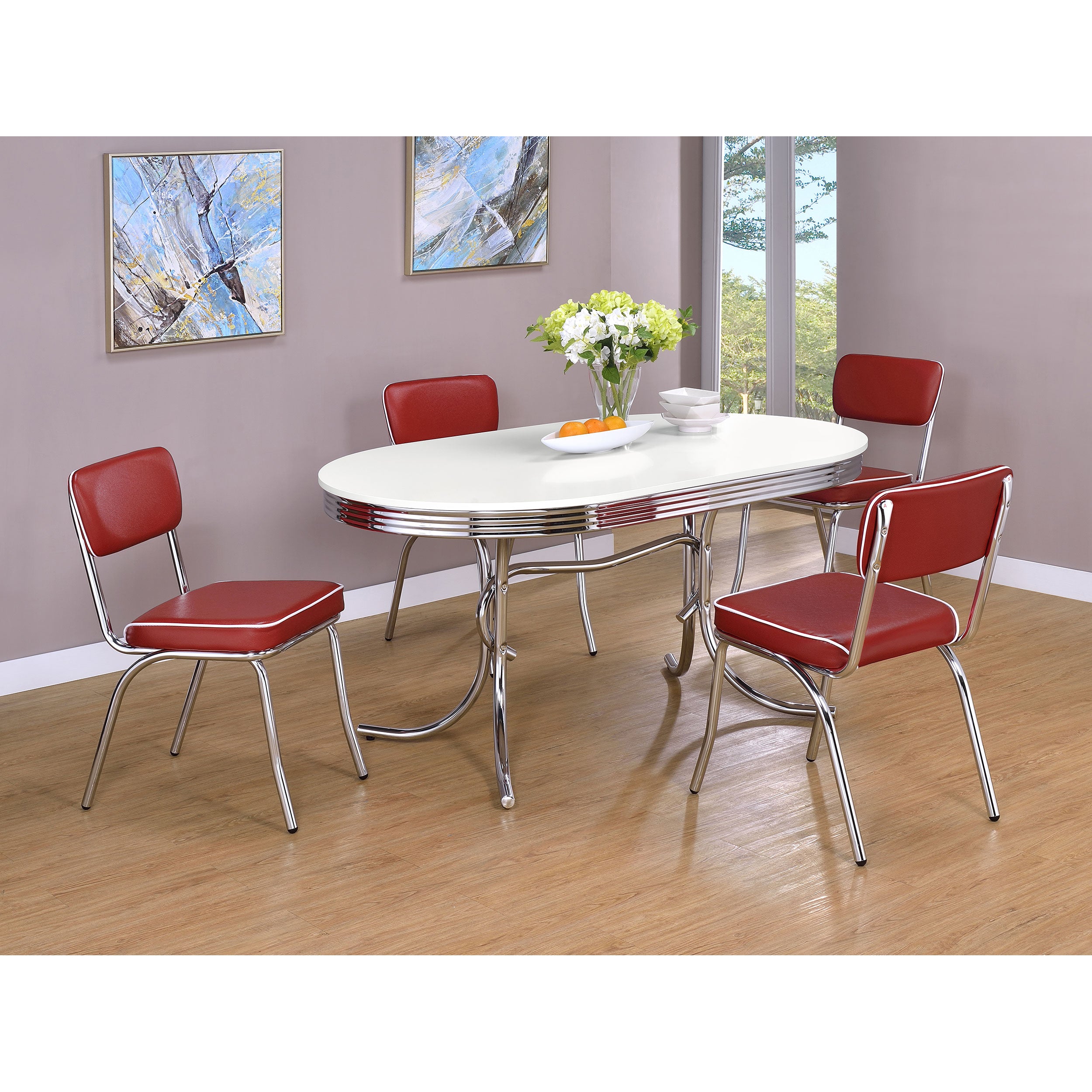 Styled dining set with the retro oval table and four red upholstered chrome chairs
