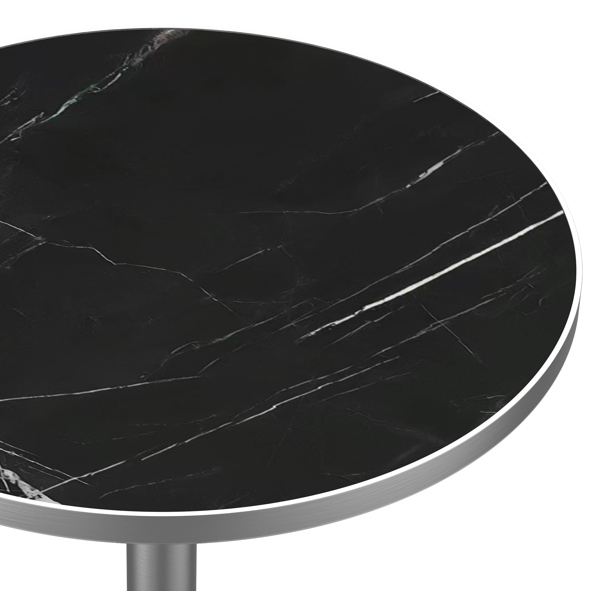 Close-up of the black marble-look tabletop surface and brushed silver edge