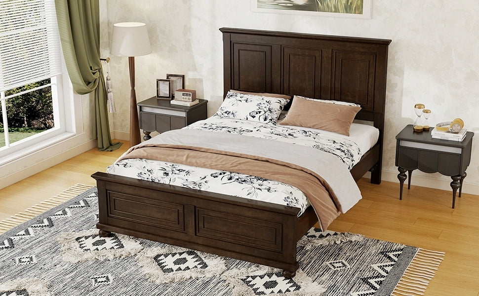 High angle from the foot of the rich brown queen bed, panel footboard and turned bun feet on a patterned rug