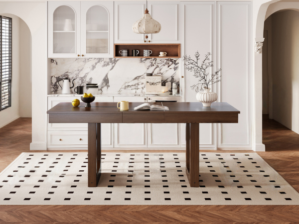 Front room view of the walnut farmhouse dining table in a marble-accented kitchen
