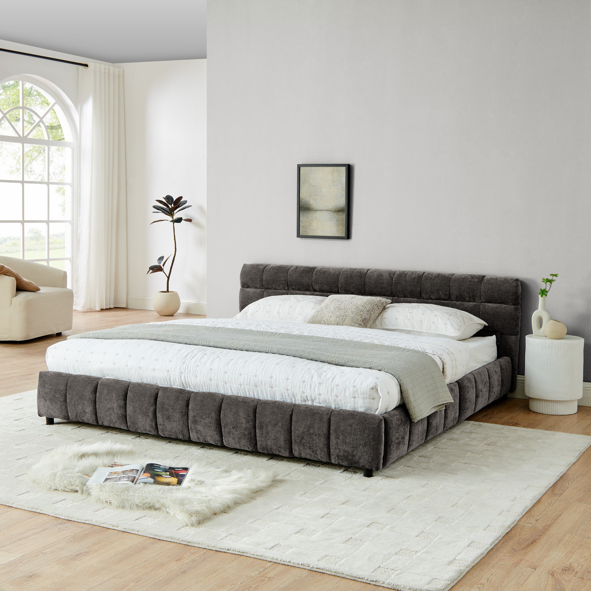 Dark gray chenille king bed frame in bedroom with fringe rug