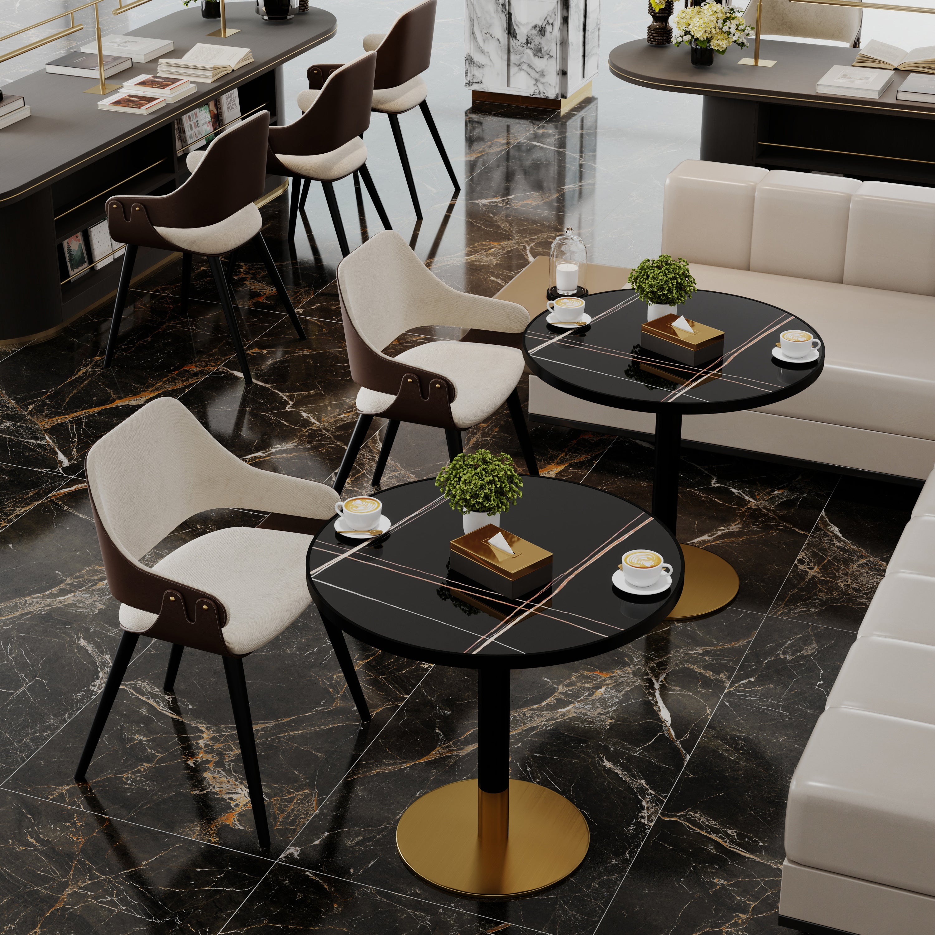 Overhead cafe view of two black sintered stone round tables with cream chairs and coffee cups