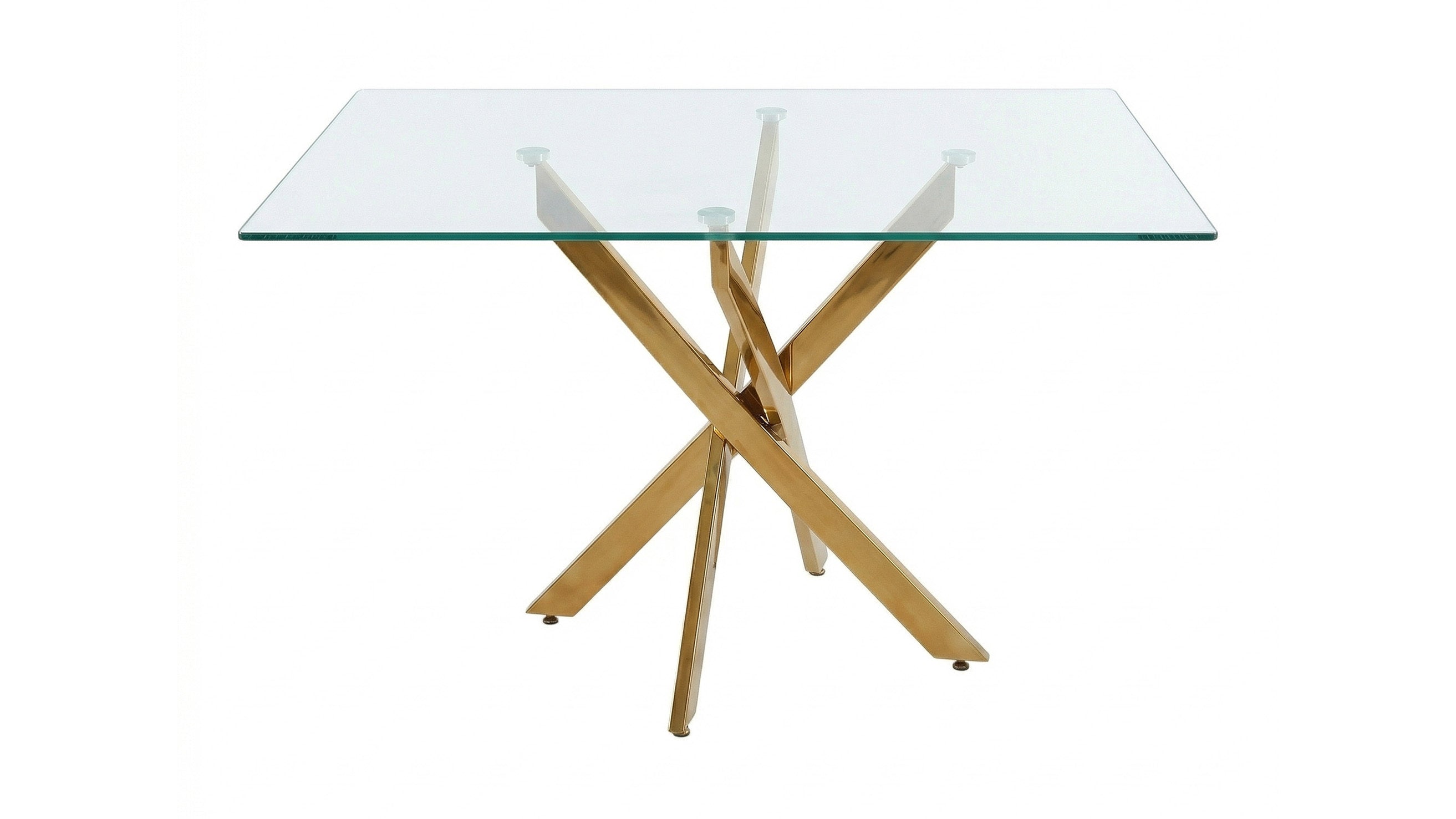 Wide three-quarter studio view of the glass dining table with gold legs