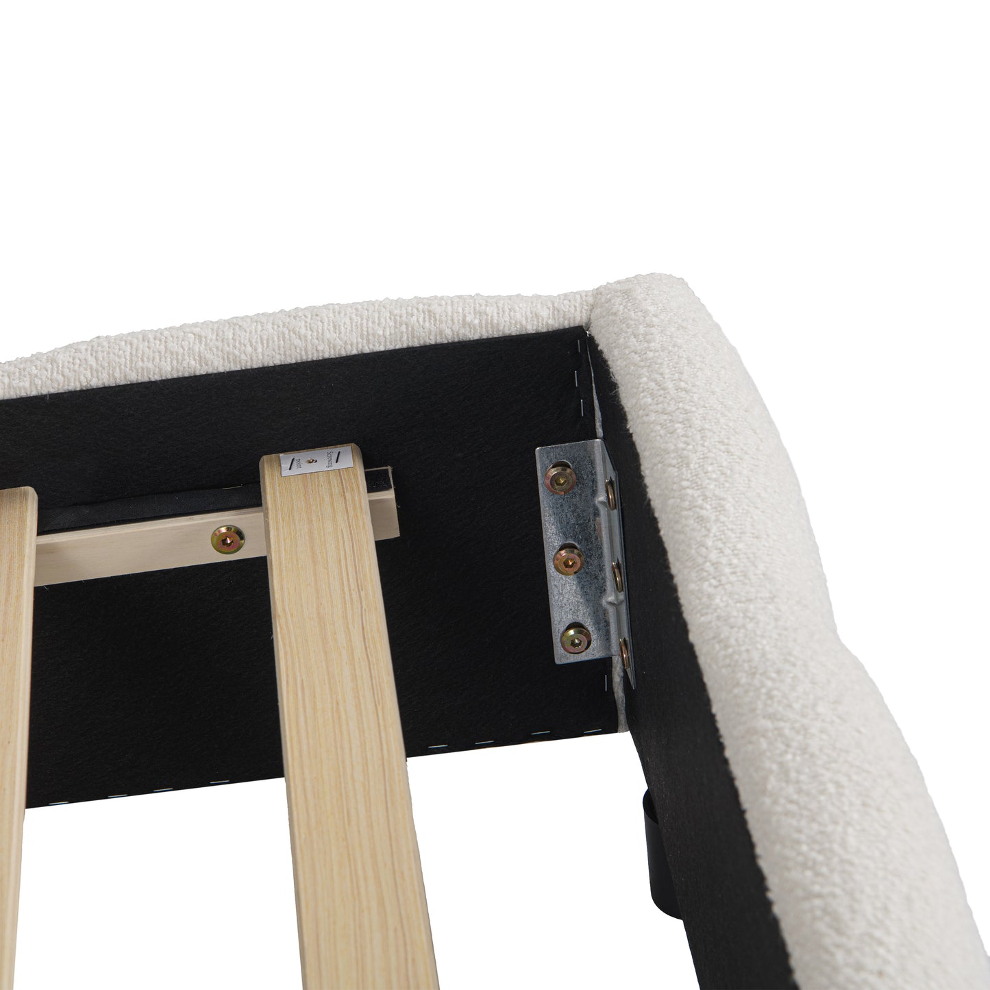 Close-up of channel-tufted beige bouclé fabric seams on headboard