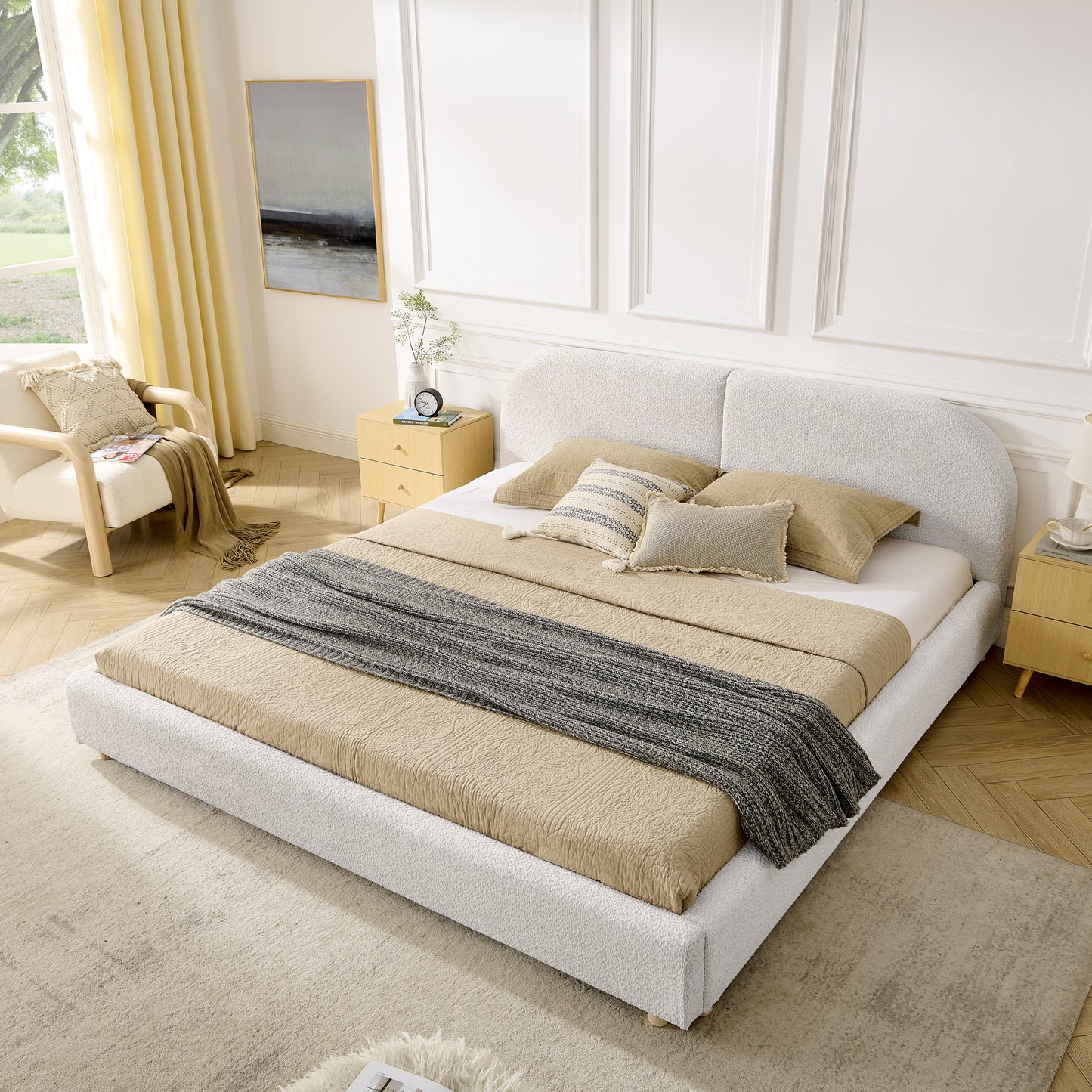 Beige curved headboard king bed, angled bedroom view with yellow curtains