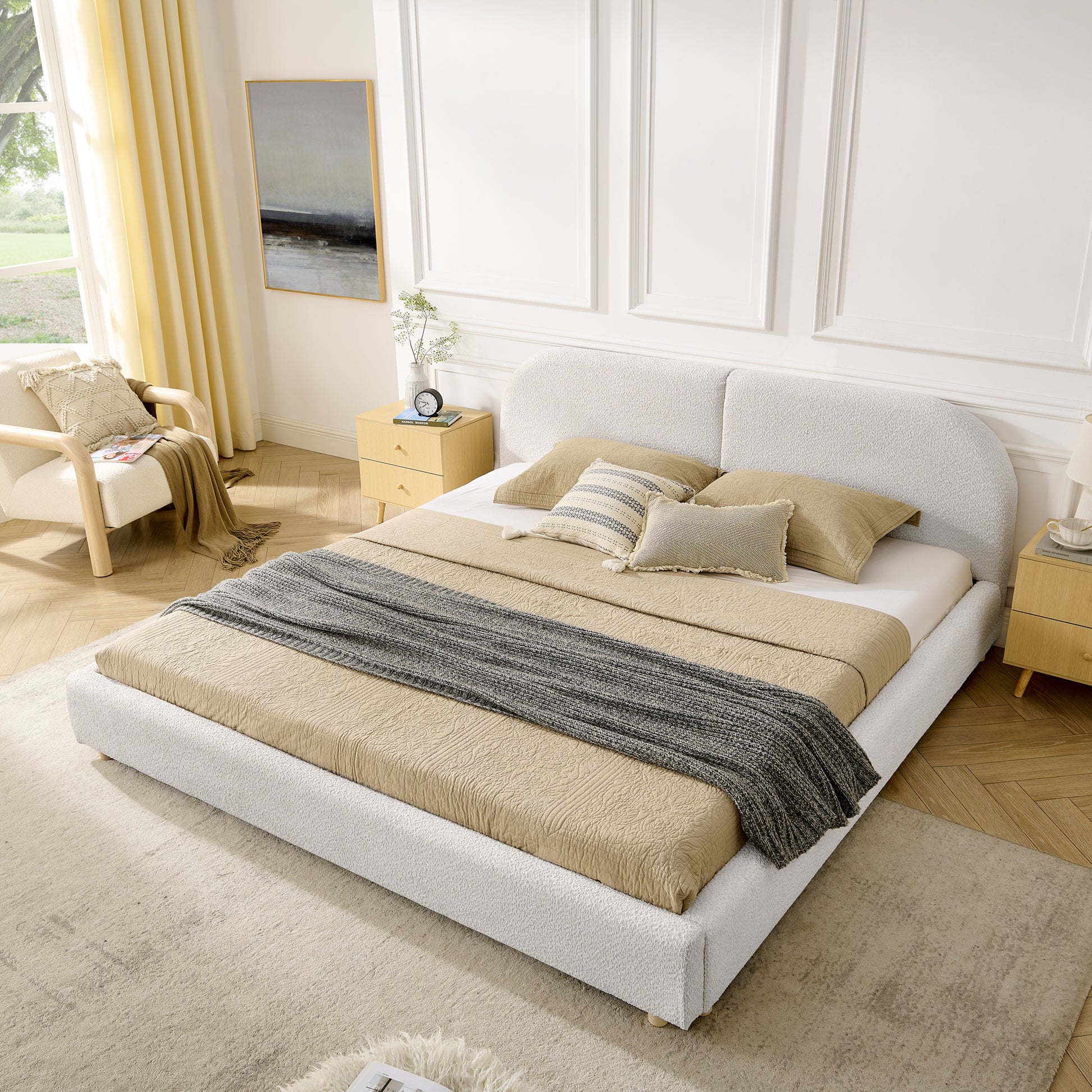 Beige curved headboard king bed, angled bedroom view with yellow curtains