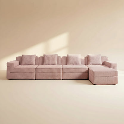 studio shot of the boneless couch in pink showing the rich corduroy fabric comfortable deep seats four seats and ottoman