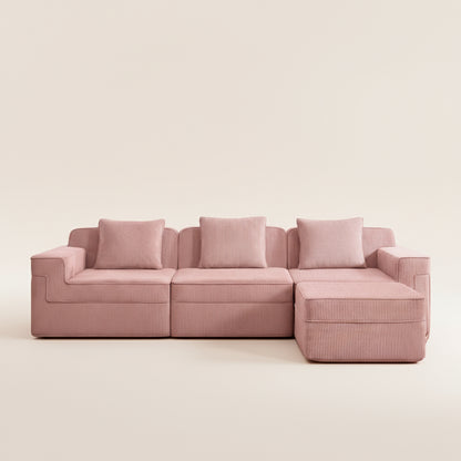 studio photography of the boneless couch in pink showing the corduroy upholstery as well as the texture and comfort of the three seat sectional