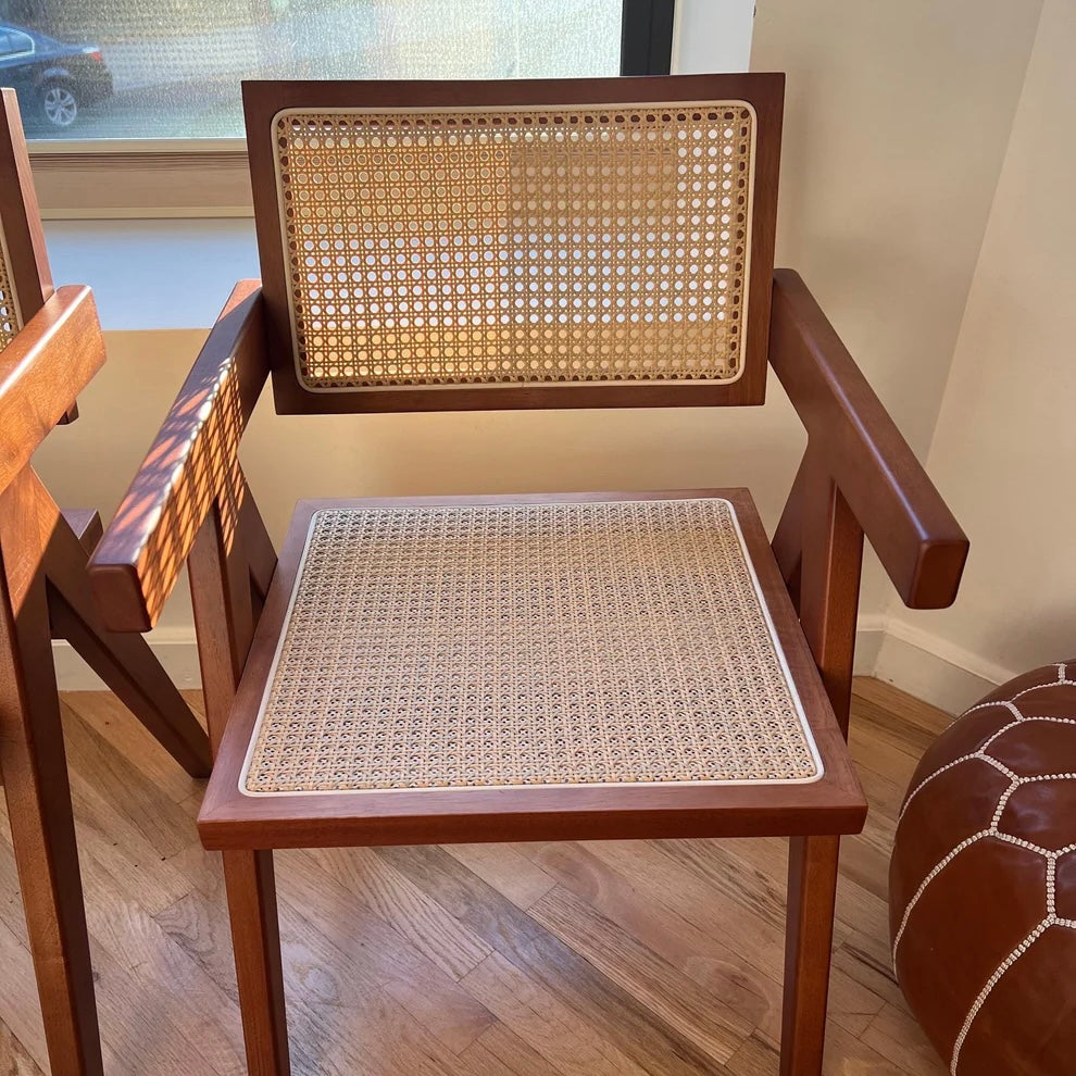 Front view of mid century modern walnut stain solid wood dining chair with rattan seat and seatback