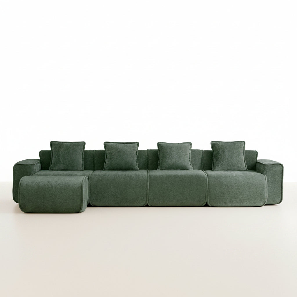 studio shot of the seneca boneless couch with four seats and one ottoman in olive velvet