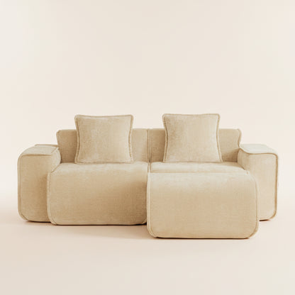 studio shot of the boneless couch in camel showing two seats and one ottoman
